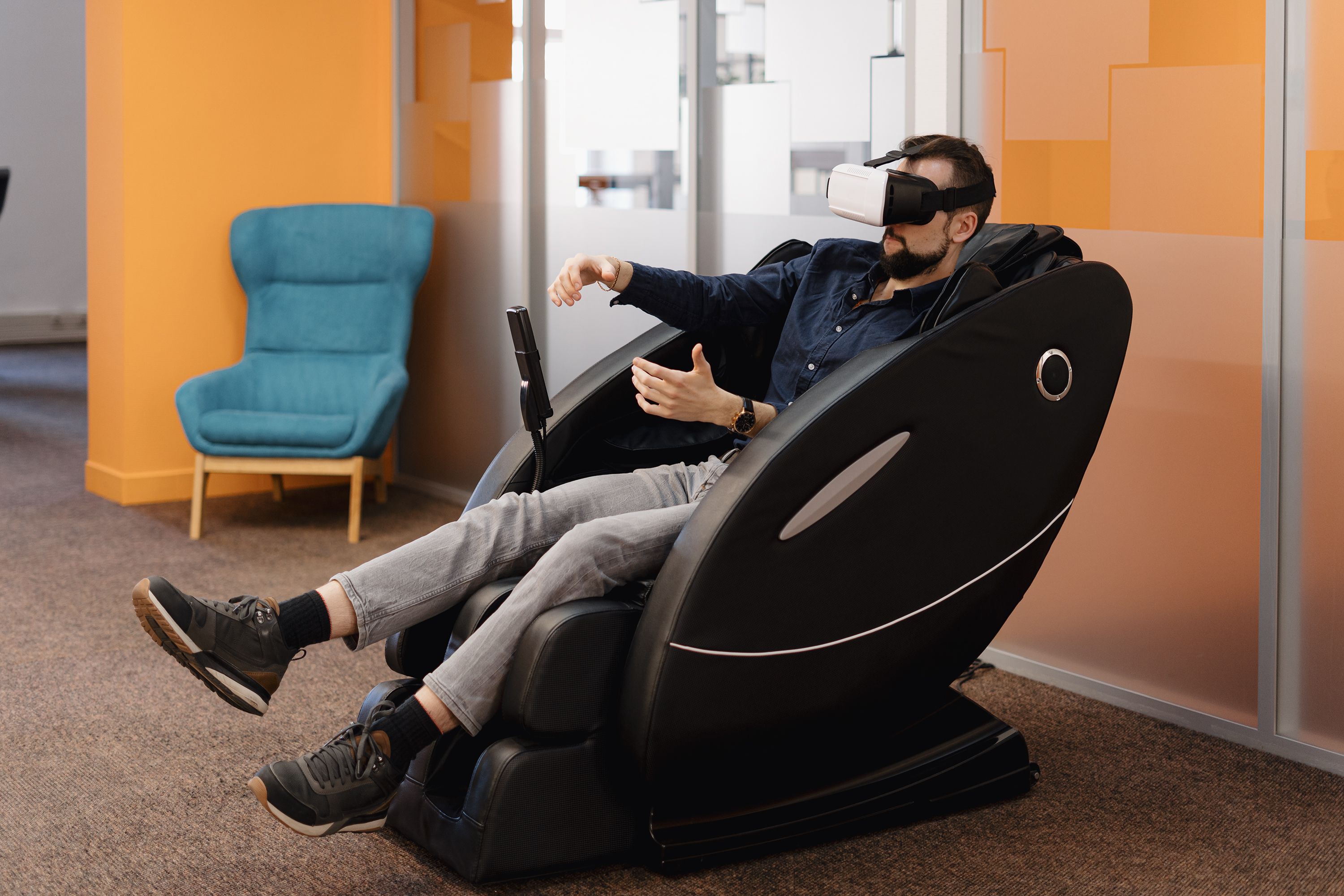 man-massaging-armchair-using-vr-technology.jpg